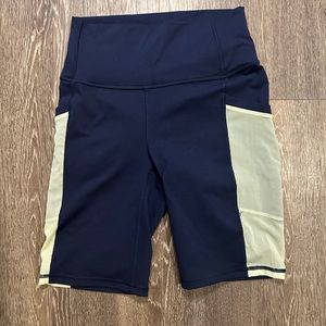 Fabletics Power Hold Shorts with side pockets, Navy Blue and Yellow, Small